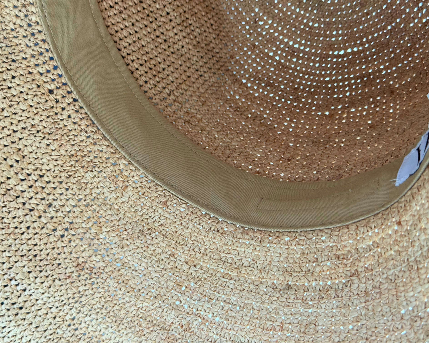 Handwoven sunhat detail showcasing the lightweight fibers and airy weave of the PALMA Sunhat.